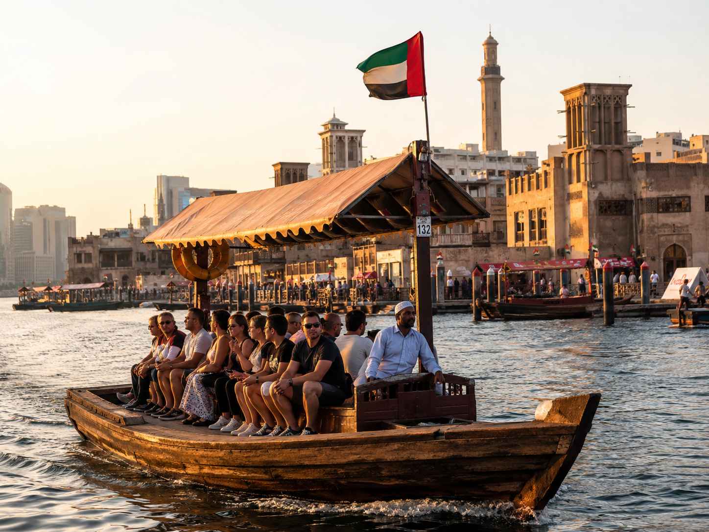 Experience a traditional Abra ride connecting Old Dubai and the famous souks.