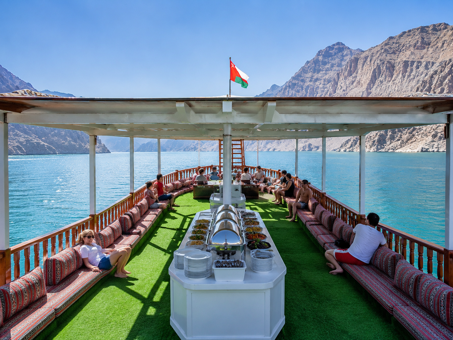 Relax on spacious cushioned decks with 360° Musandam fjord views — all included in your cruise