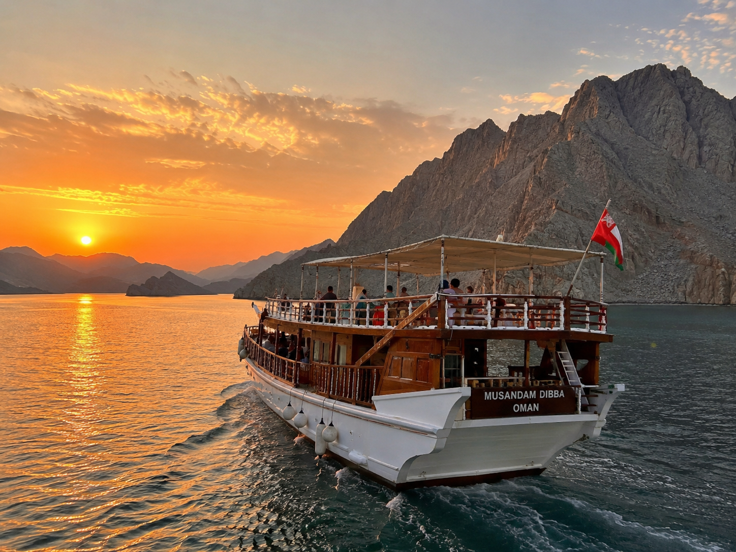 Sail into a golden Musandam sunset aboard the Musandam Dibba dhow, Oman