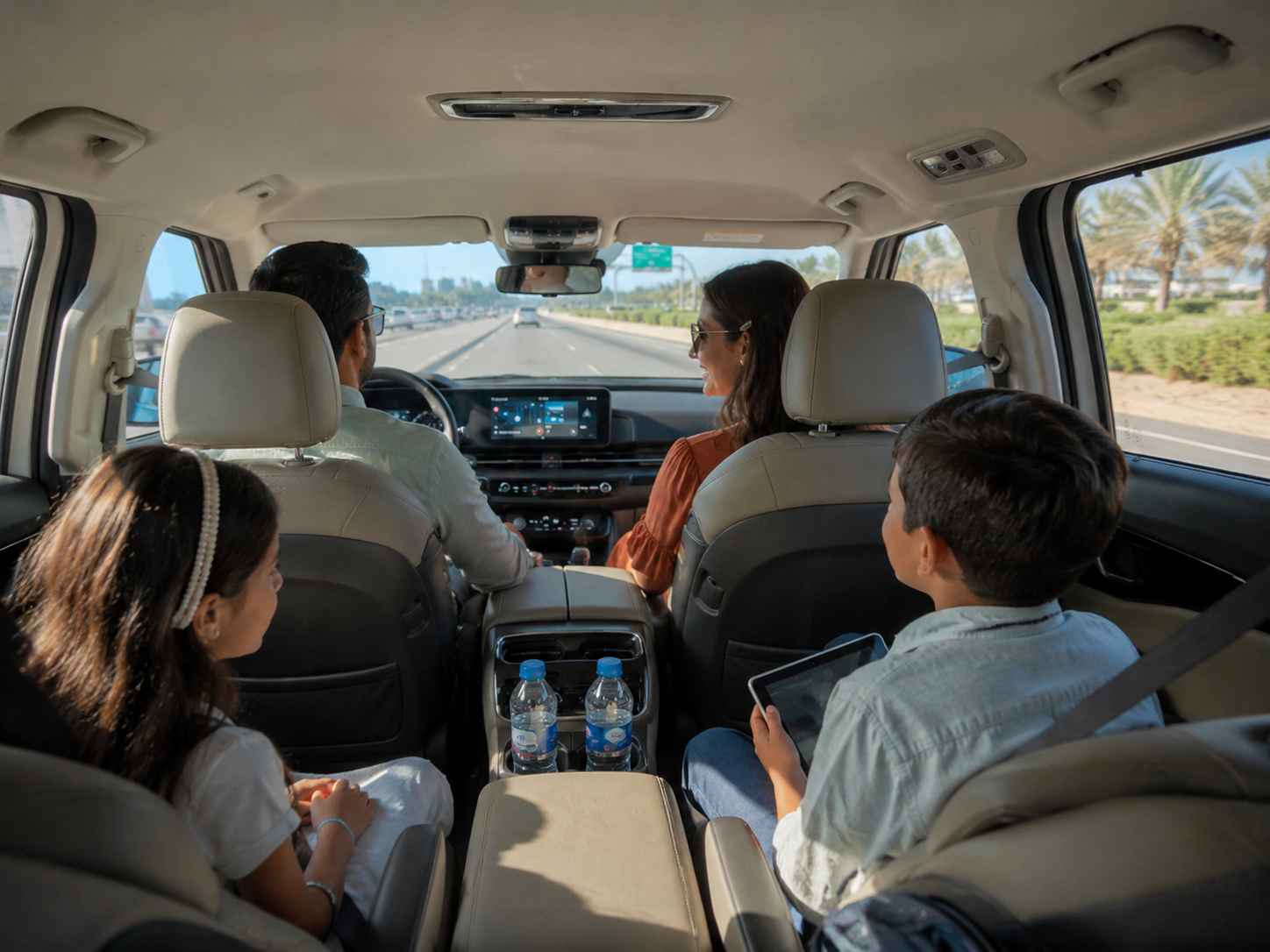 Relax in a clean, spacious Kia Carnival with comfortable seating during your AUH airport transfer.